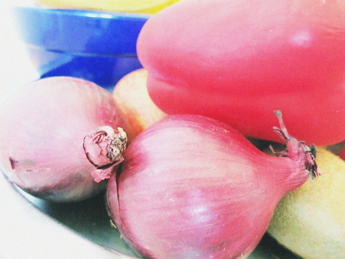red onions in a bowl of fruit and vegetable